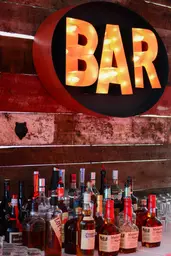 B-A-R sign - Orange and black used in the inspiration Enseigne Bar Ovale